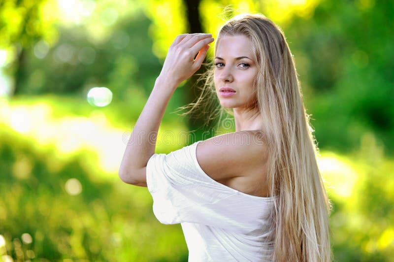 Pretty young girl portrait in sunset