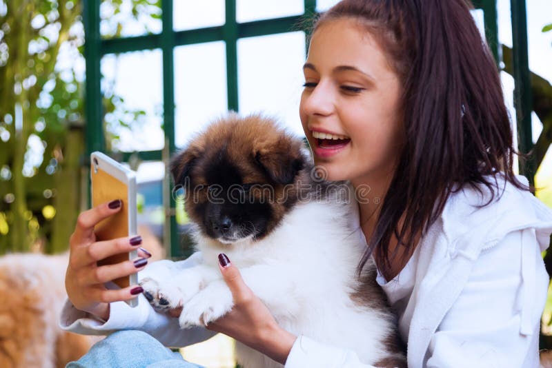 Pretty young girl with a puppy