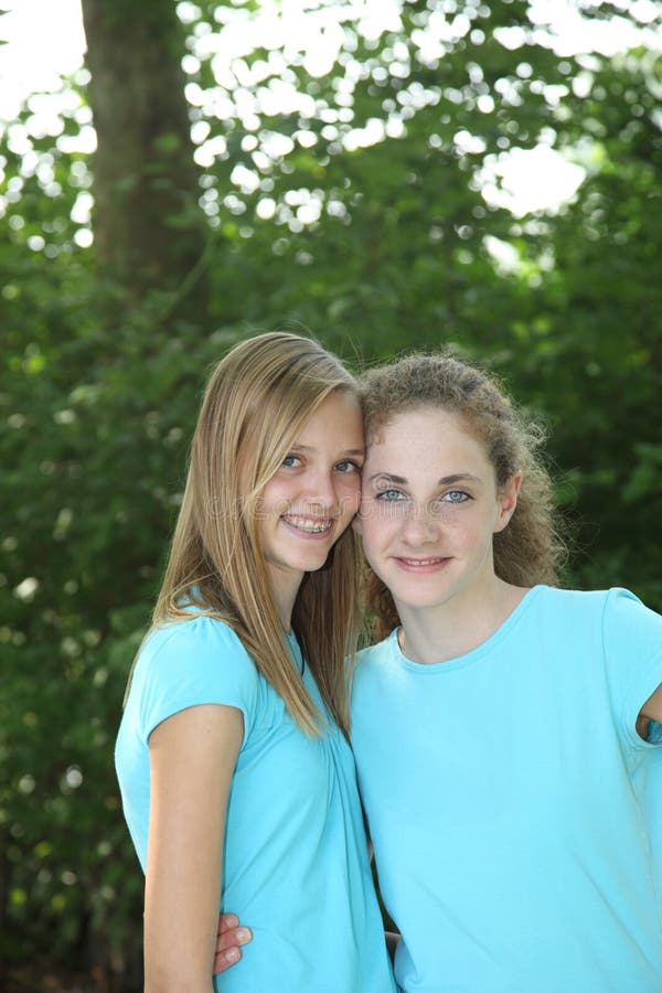 Pretty young girls in matching blue tops