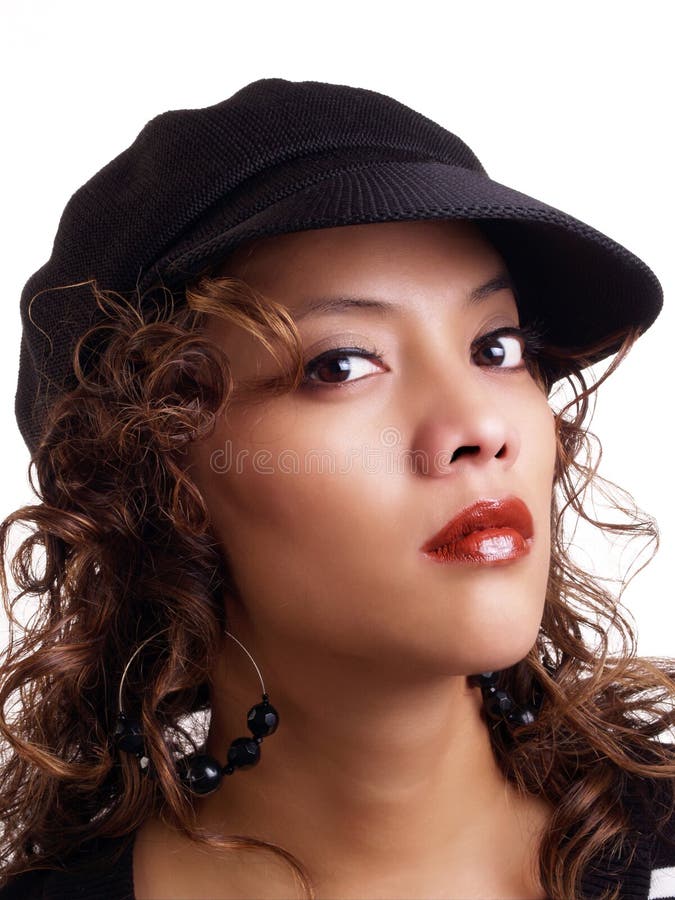 Pretty young hispanic woman wearing black hat