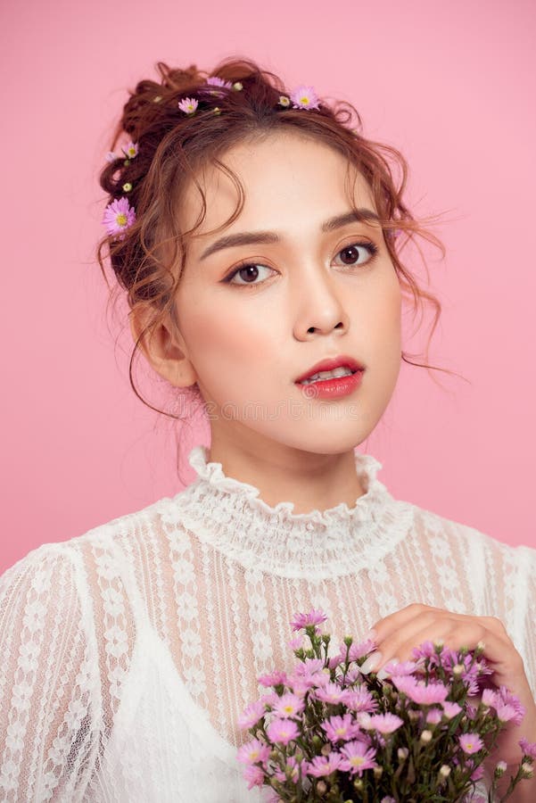 Pretty Young Lady with Flowers Looking at Camera Stock Image Image of