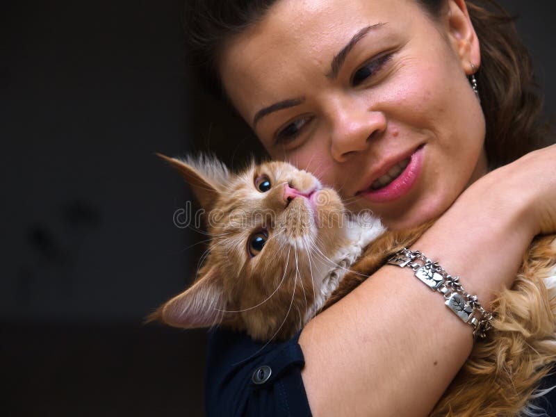 Pretty young woman with a cat