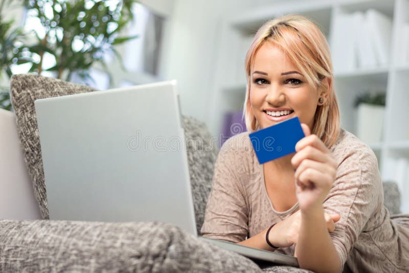 Pretty young woman with credit card