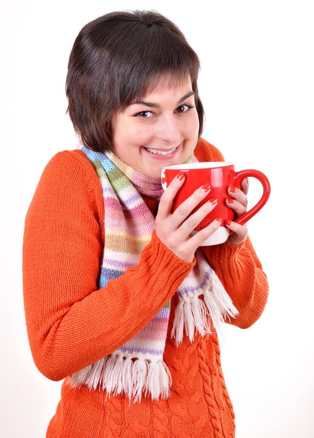 Pretty young woman drinking hot tea