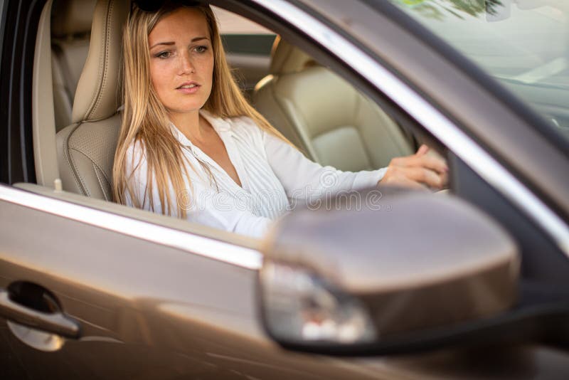 Pretty, Young Woman Driving a Car Stock Photo - Image of credit ...