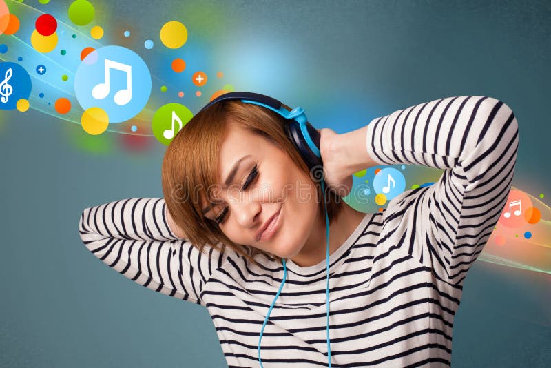 Young woman listening to music with headphones