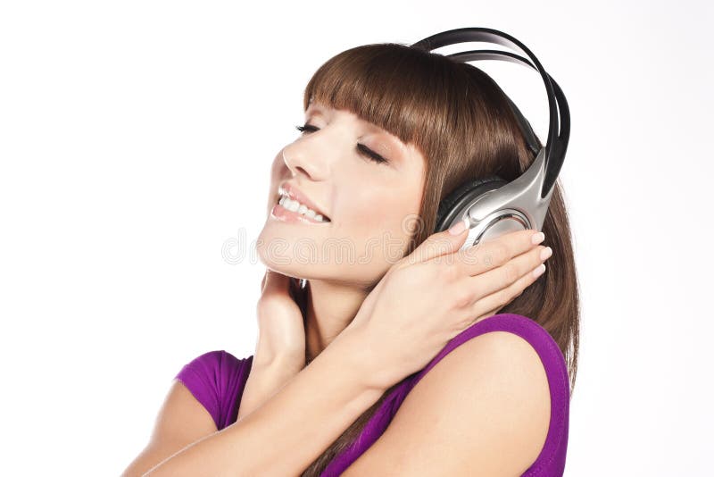 Pretty young woman listening music