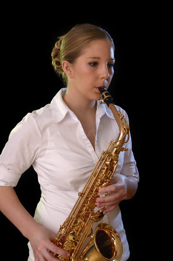 Pretty young woman playing saxophone royalty free stock image Pretty young woman playing saxophone royalty free stock image