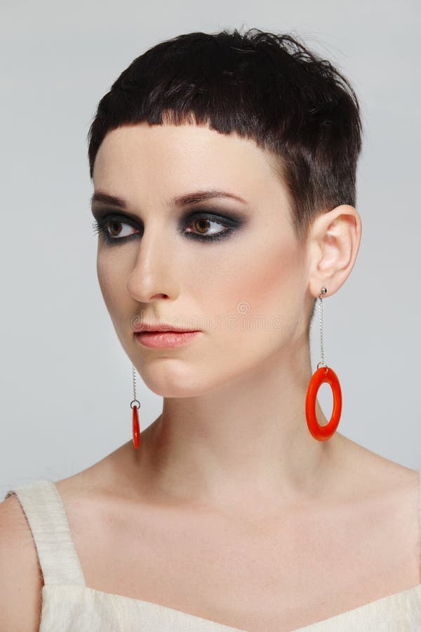 Pretty Young Woman with Short Black Hair and Red Earrings Stock Image -  Image of hair, look: 189303821
