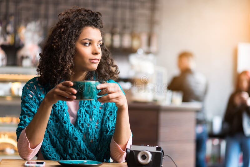 Pretty young woman waiting for someone in cafe stock photos Pretty young woman waiting for someone in cafe stock photos