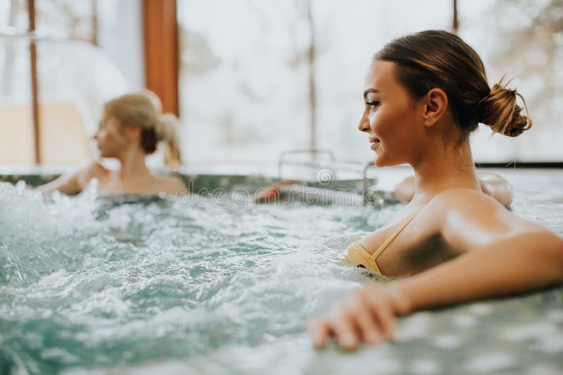 Young woman relaxing in the whirlpool bathtub stock images Young woman relaxing in the whirlpool bathtub stock images