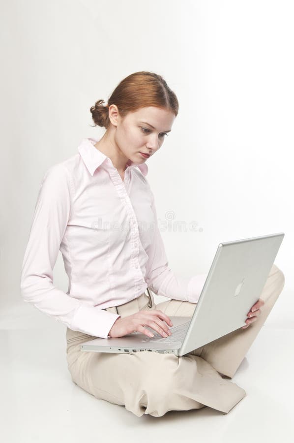 Pretty young women seatting with laptop