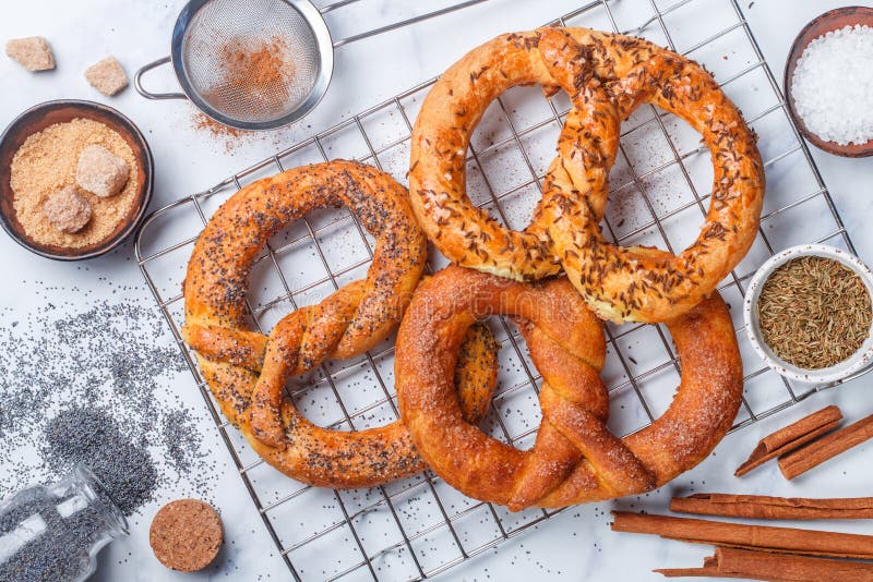 Pretzel. Freshly baked pretzels with sugar, poppy seeds, cinnamon and cumin