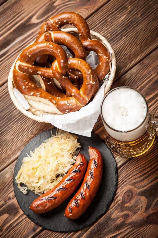 Pretzels, Bratwurst and Sauerkraut Stock Photo - Image of bavarian ...