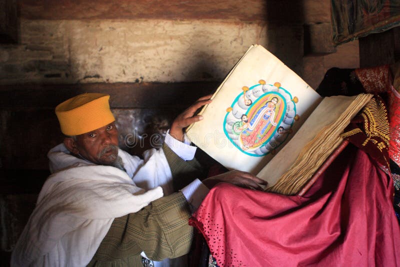 A Priest Displays Sacred Illustrations From A Holy Book stock images A Priest Displays Sacred Illustrations From A Holy Book stock images