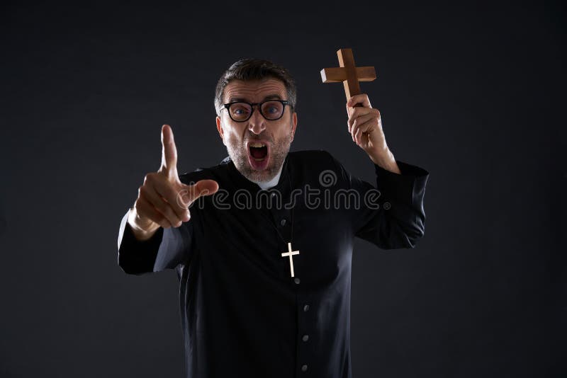 priest-holding-cross-wood-praying-shouting-priest-holding-cross-wood-praying-129853236.jpg