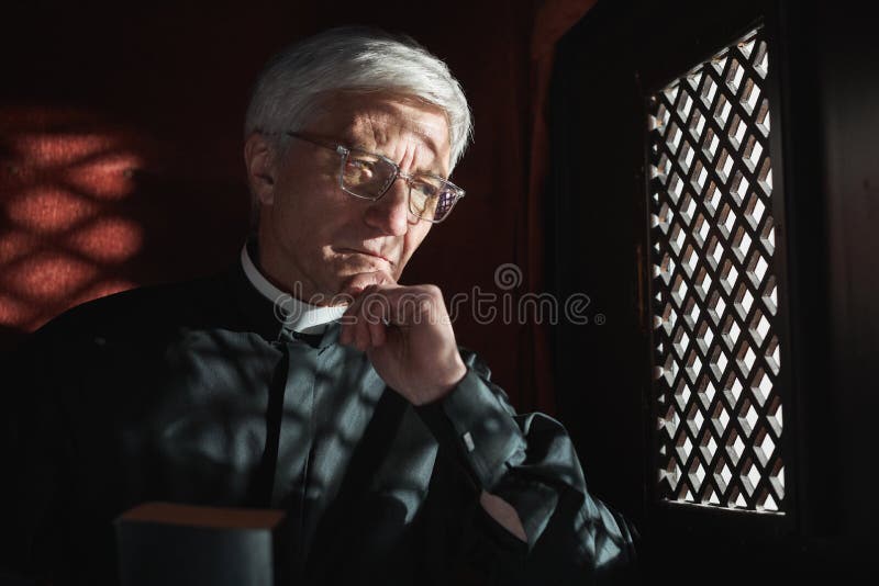 Priest listening to the confession