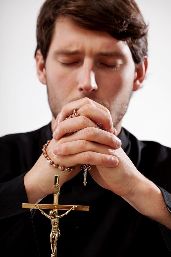 Priest is praying the rosary royalty free stock image Priest is praying the rosary royalty free stock image