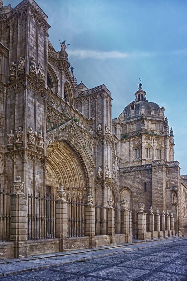 The Primate Cathedral of Saint Mary of Toledo is a Roman Catholic church in Toledo, Spain. It is the seat of the Metropolitan Archdiocese of Toledo. The cathedral of Toledo is one of the three 13th-century High Gothic cathedrals in Spain and is considered, in the opinion of some authorities, to be the magnum opus of the Gothic style in Spain. The spectacular incorporation of light and the structural achievements of the ambulatory vaults are some of its more remarkable aspects. It is built with white limestone from the quarries of Olihuelas, near Toledo. The Primate Cathedral of Saint Mary of Toledo is a Roman Catholic church in Toledo, Spain. It is the seat of the Metropolitan Archdiocese of Toledo. The cathedral of Toledo is one of the three 13th-century High Gothic cathedrals in Spain and is considered, in the opinion of some authorities, to be the magnum opus of the Gothic style in Spain. The spectacular incorporation of light and the structural achievements of the ambulatory vaults are some of its more remarkable aspects. It is built with white limestone from the quarries of Olihuelas, near Toledo.