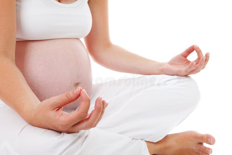 Primer de la mujer que hace yoga meditativa del embarazo fotografía de archivo Primer de la mujer que hace yoga meditativa del embarazo fotografía de archivo