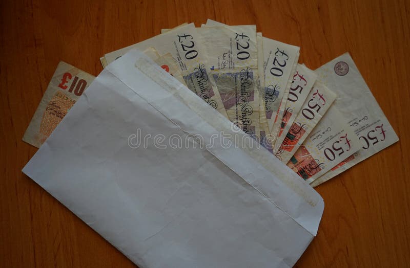 Envelope full of british pounds as a piece of certainty in the uncertain forthcoming Brexit. Envelope full of british pounds as a piece of certainty in the uncertain forthcoming Brexit