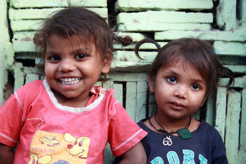 Poor children from a urban slum smiling in new delhi, india. Poor children from a urban slum smiling in new delhi, india