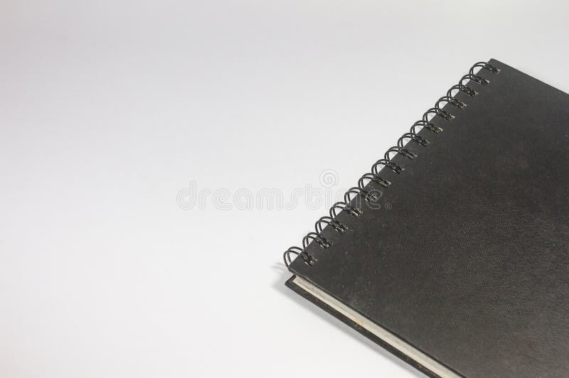 Primer de un cuaderno en blanco del negro de la carpeta en un fondo blanco fotografía de archivo Primer de un cuaderno en blanco del negro de la carpeta en un fondo blanco fotografía de archivo