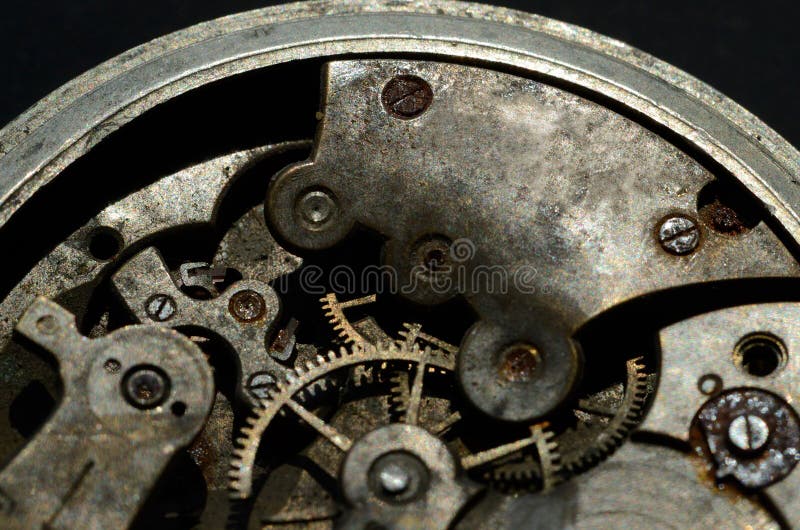 Primer del viejo mecanismo del reloj, fondo para el diseño del vintage imagenes de archivo Primer del viejo mecanismo del reloj, fondo para el diseño del vintage imagenes de archivo