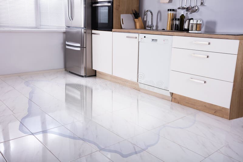 Close-up Photo Of Flooded Floor In Kitchen From Water Leak. Close-up Photo Of Flooded Floor In Kitchen From Water Leak