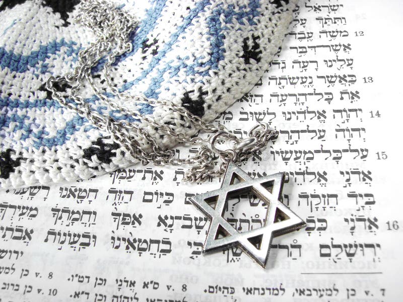 Jewish religious symbols - star of David, Torah hebrew, yarmulke - closeup. Jewish religious symbols - star of David, Torah hebrew, yarmulke - closeup.