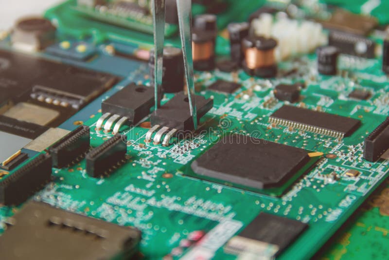 Printed Circuit Board with Many Electrical Components Stock Photo