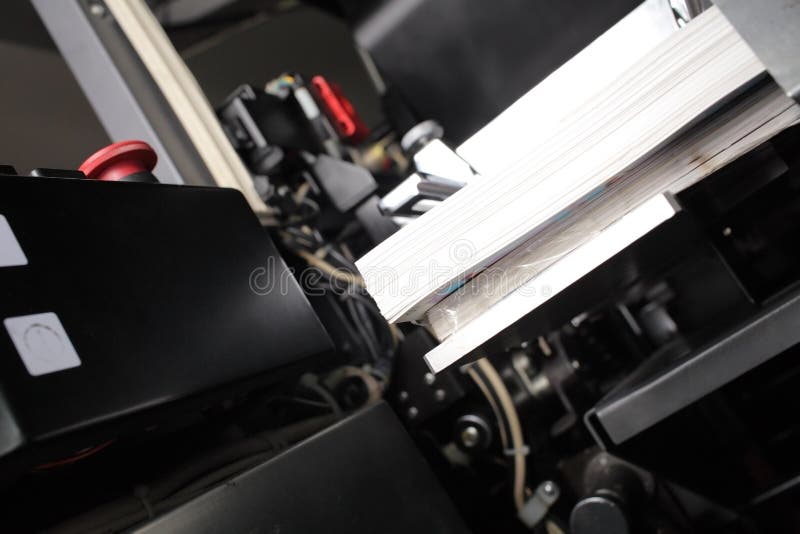 Printed products in offset machine royalty free stock photo
