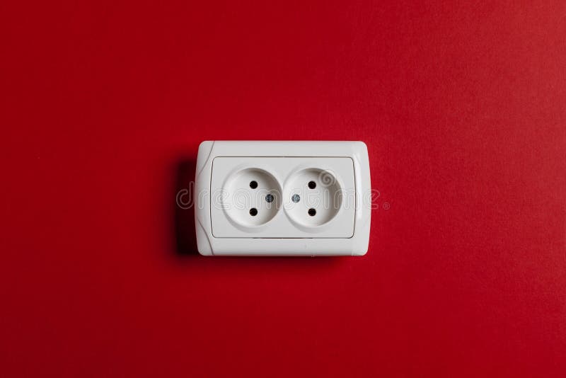 Prise sur le mur rouge images stock Prise sur le mur rouge images stock