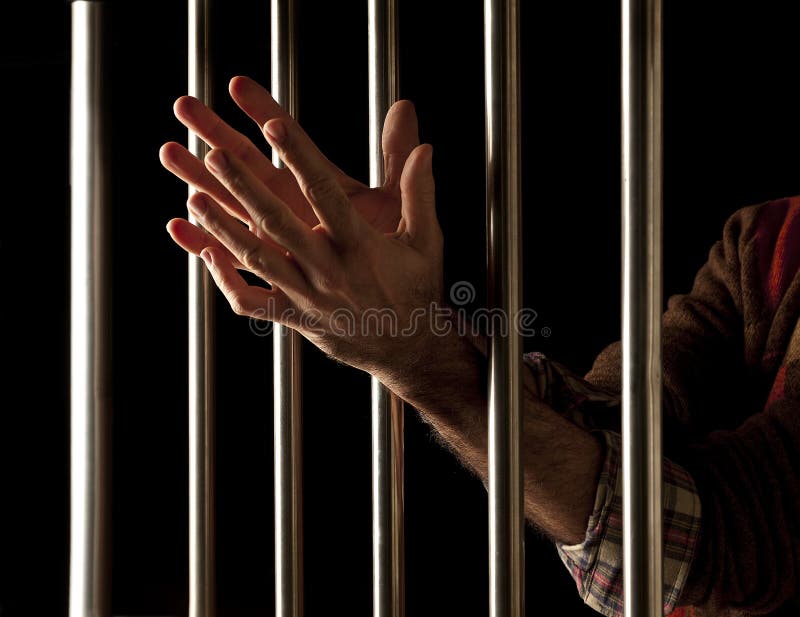 Prisoner behind bars