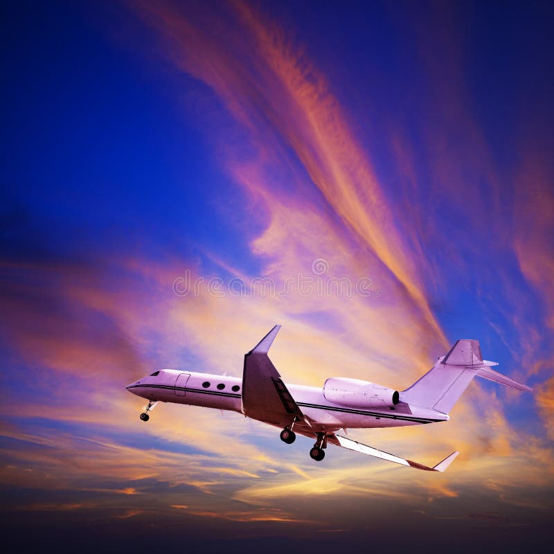 Private jet in a spectacular sunset sky