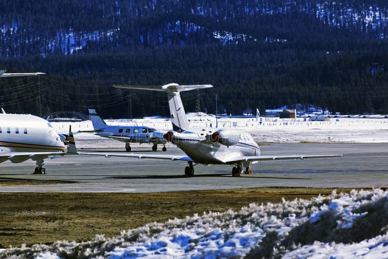 Private jets and planes in the airport of St Moritz Switzerland in the alps royalty free stock images Private jets and planes in the airport of St Moritz Switzerland in the alps royalty free stock images