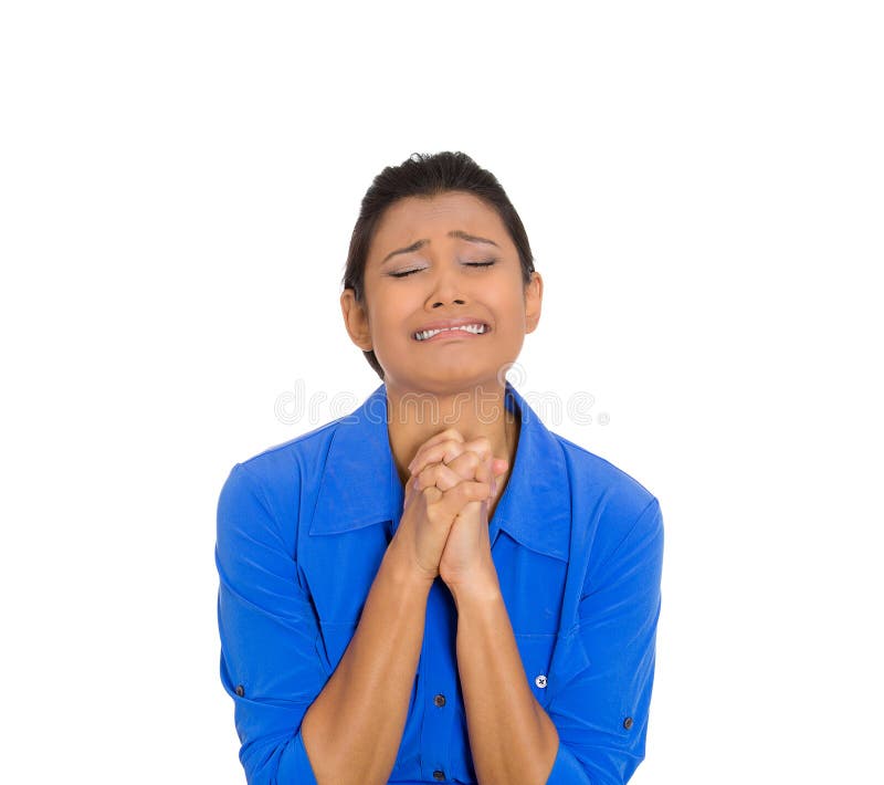 Closeup portrait of young funny looking woman with closed eyes, praying hoping for best asking forgiveness, miracle isolated on white background. Positive human emotions, facial expression, feelings. Closeup portrait of young funny looking woman with closed eyes, praying hoping for best asking forgiveness, miracle isolated on white background. Positive human emotions, facial expression, feelings