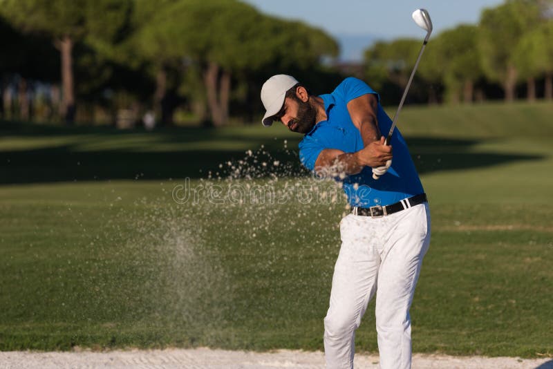 Pro golfer hitting a sand bunker shot