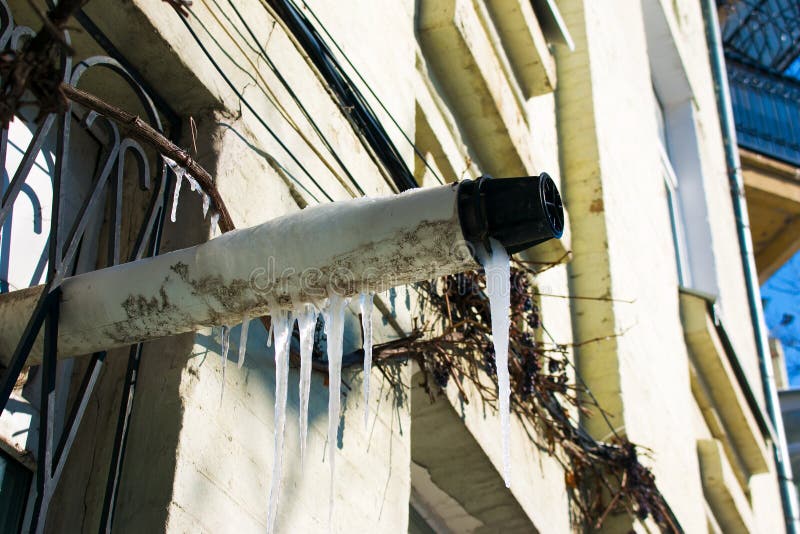 Problem of Air Conditioning Ventilation in Winter, Icing of Outlet Pipe. Stock Photo Image of