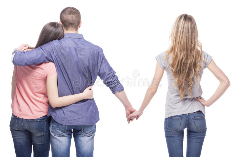 Love triangle. Handsome men embrace his girlfriend while holding hands with another girl. isolated on white background. Love triangle. Handsome men embrace his girlfriend while holding hands with another girl. isolated on white background.