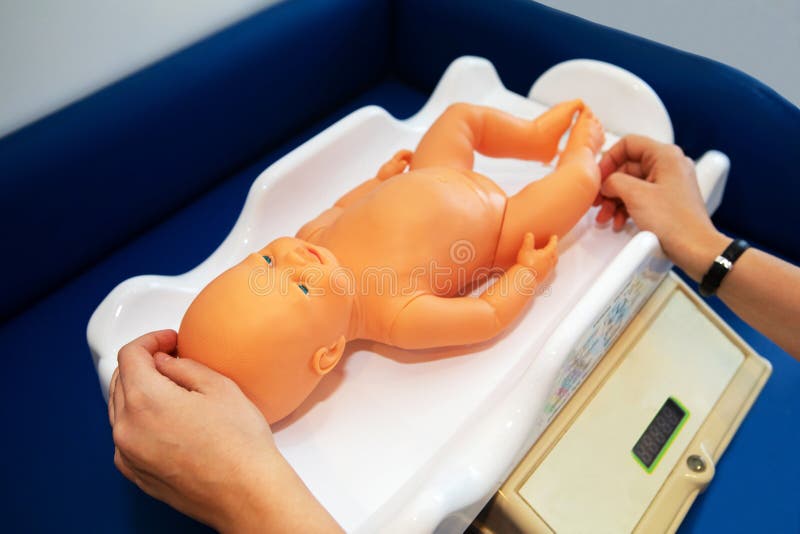 Weighing a Newborn Baby on a Scale in a Maternity Hospital, Isolated O  Stock Photo - Image of white, medicine: 276647452