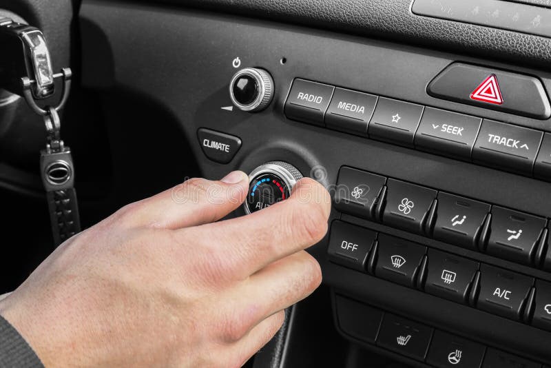 The Process of Choosing Climate Control in the Car. Man Regulating