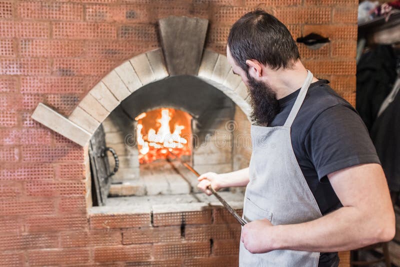 The Process of Cooking Baking Oven in the Countryside Stock Image