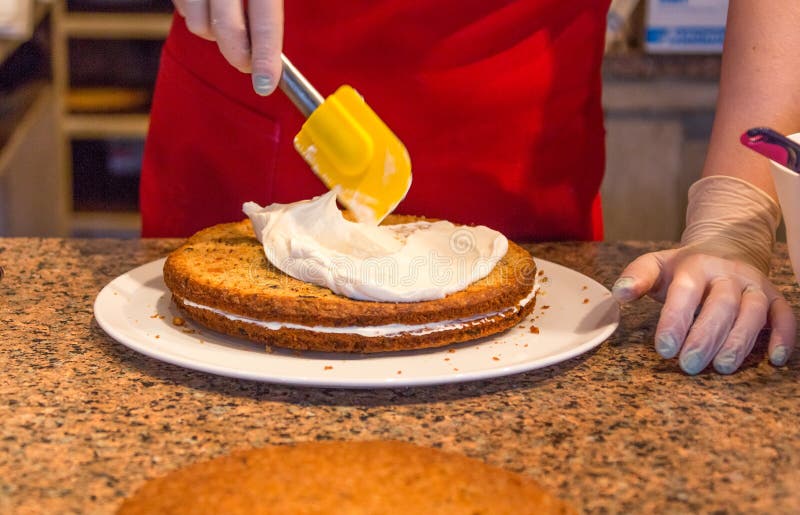 Process of Cooking Sponge Cake Apply Cream in Restaurant Stock Image