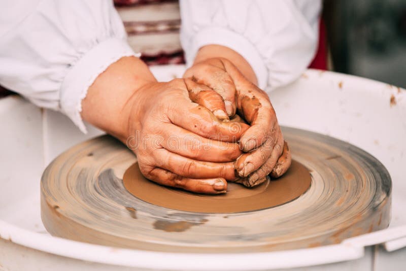 Process of Creating a Clay Pot. Using Hands. Pottery Craft Wheel and
