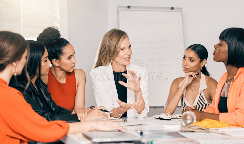 In the process of creating something good. a group of businesswomen in a meeting at work. stock photos