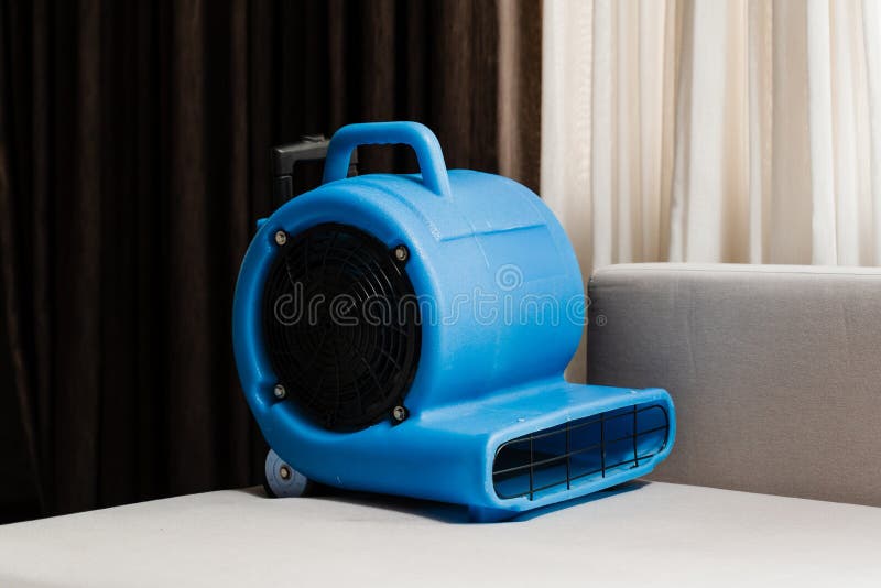 Floor dryer blower fan machine in bathroom drying wet floor Stock Photo