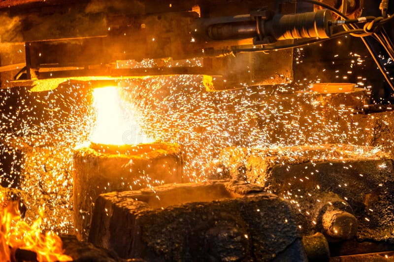 The Process of Filling Liquid Metal with Steel Molds Stock Photo