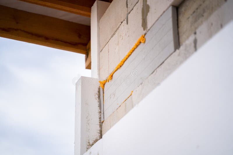 The Process of Insulating the Walls of a Polystyrene House. Reducing