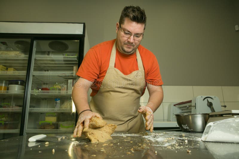 The Process of Making Bread. the Chef Kneads the Dough by Hand Stock